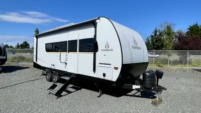 Featuring a residential queen size bed, plenty of countertop space in the fully equipped rear kitche...