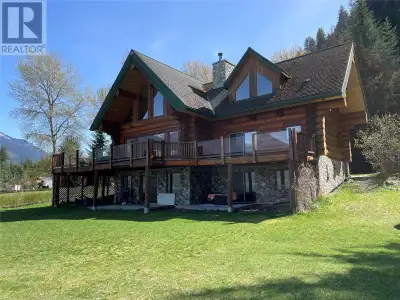Absolutely gorgeous custom log home on Kootenay Lake with a spectacular waterfront beach and world c...