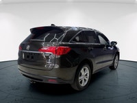 The 2015 Acura RDX in striking AWD configuration boasts an impressive handling prowess. This sophist... (image 4)