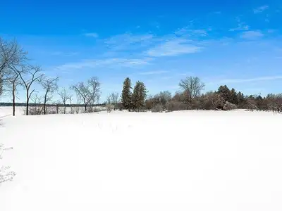 Stunning Waterfront Lot for Sale. Discover this exceptional half-acre property offering panoramic vi...