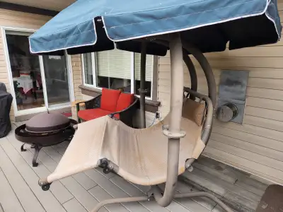Patio Swing. Moving, must sell. This is a very solid and sturdy loveseat patio swing. Excellent cond...
