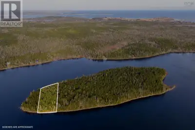 For Sale: Lakefront 1.2 acre lot on private island, with waterfrontage on both the western and easte...