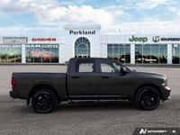 Feel the surge of a legendary *5.7L Hemi V8 engine* under your command with this striking *2023 Ram... (image 6)