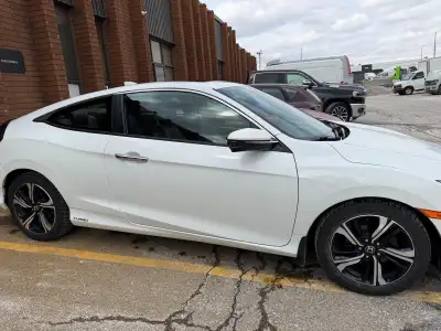 Selling my 2017 Honda Civic Touring. This is the 2-door coupe model, fully loaded with leather, navi...