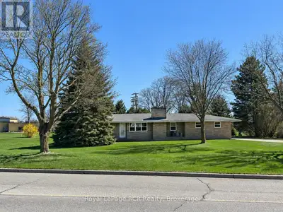Enjoy the Best of Both Worlds! This charming 3-bedroom bungalow sits on just over 0.5 acres, offerin...