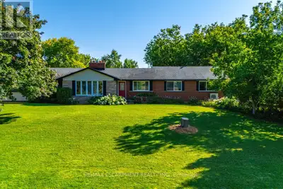 One-of-a-kind country property sitting on 10.5 acres of lush greenery just minutes from the city. Th...