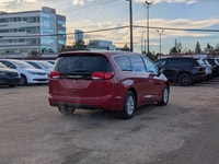 The 2026 Chrysler Grand Caravan SXT in Red Hot Pearl with a Black interior combines style, comfort,... (image 6)