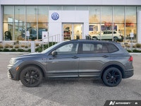 This Volkswagen Tiguan boasts a Intercooled Turbo Regular Unleaded I-4 2.0 L/121 engine powering thi... (image 1)