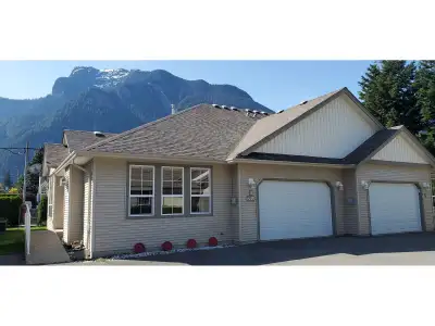 Welcome to this rarely available rancher-style half duplex in a highly sought-after complex' Bright...