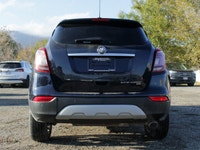 Introducing the 2022 Buick Encore Preferred AWD, a striking black SUV that combines all-wheel drive... (image 5)