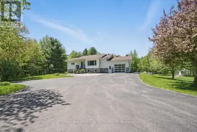 Nestled on (almost) 25 sprawling acres, this recently renovated raised-bungalow offers unparalleled...
