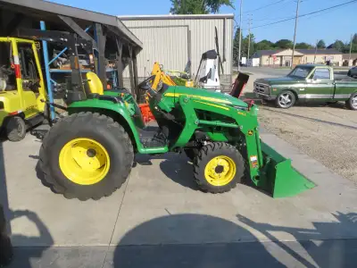 with factory loader 300E; hydrostatic drive; 3 pth; rear PTO; 32HP; ONLY 119 HOURS; also has rear re...
