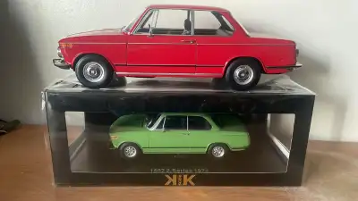 1-12 scale - aprox 35 cm long - New in its box. Doors are opening . The green BMW is not for sale ,...