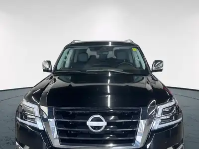 Experience luxury and power in the 2024 Nissan Armada 4x4 Platinum, presented in an eye-catching Bla...
