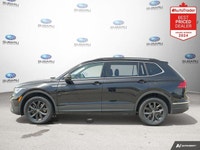 New Price! Odometer is 13972 kilometers below market average! Deep Black Pearl 2024 Volkswagen Tigua... (image 1)