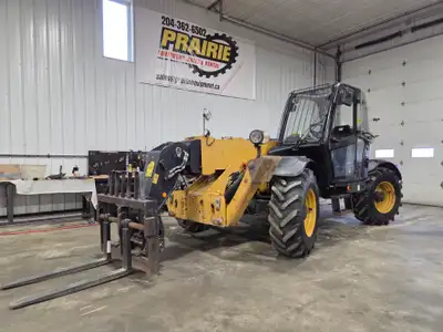 2013 Caterpillar TH414C Telehandler w/ Forks — $55,000 Mid-size Cat rough-terrain telehandler with a...