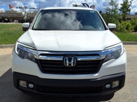 NEW TO CANADA? WE HAVE AN APPROVAL WAITING FOR YOU! The 2017 Honda Ridgeline EX-L is a versatile pic... (image 1)