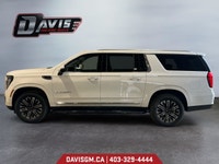 The 2025 GMC Yukon XL Elevation 4WD commands attention with extended-length presence, bold monochrom... (image 1)