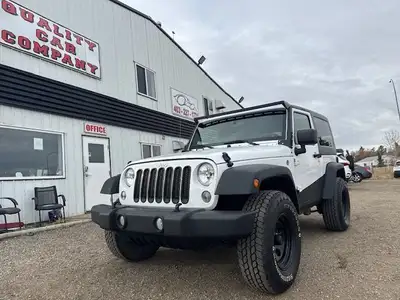 CHRISTMAS SALE! WARRANTY, 2ND SET TIRES/WHEELS, SOFT TOP The Jeep Wrangler, shown here in White, is...