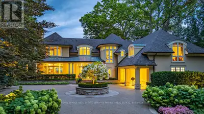 Gracefully set along the shores of Lake Ontario, this exceptional custom estate-designed by Gren Wei...