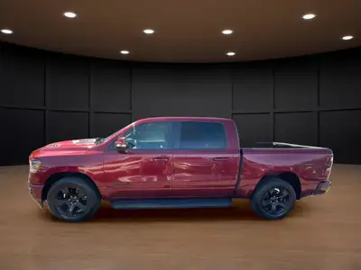 Introducing the stunning red 2023 Ram 1500 Sport 4x4 Crew Cab 5'7" Box, designed to handle the road...