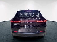 Introducing the 2024 Dodge Hornet GT AWD, a dynamic SUV that commands attention with its black-on-bl... (image 9)