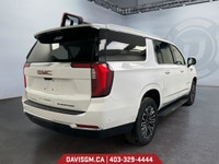 The 2025 GMC Yukon XL Elevation 4WD commands attention with extended-length presence, bold monochrom... (image 4)