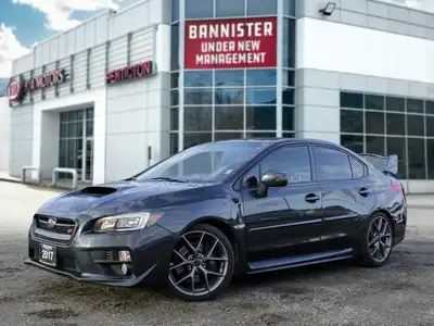 Feel the thrill of the road with the 2017 Subaru WRX STI Sport, finished in a striking shade of gray...