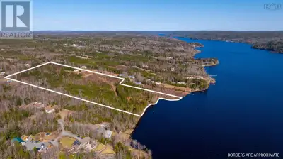 Located in a highly desirable neighborhood, this stunning 19-acre parcel of waterfront land offered...
