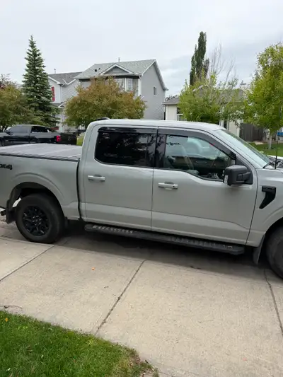 2024 Ford F-150 XLT SuperCrew 4x4 with the 2.7L EcoBoost engine, FX4 Off-Road Package, and Black App...