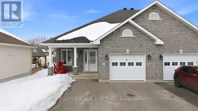 Tucked away on a quiet cul-de-sac, this sought-after semi-detached 2+1 bedroom/ 2 bathroom bungalow...