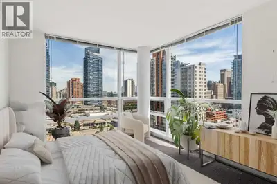 Gorgeous downtown views and maintenance-free urban living await in this sophisticated 2 bedroom end...
