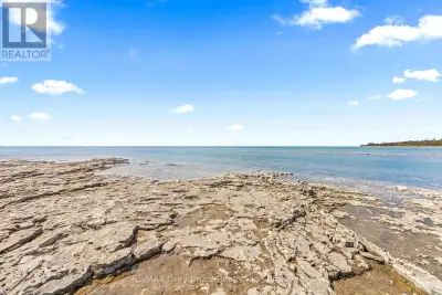 PRISTINE SHORELINE & STUNNING VIEWS! Enjoy 100ft. of clean, gradual, Lake Huron waterfront with Nort...