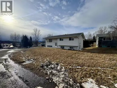 Affordable family home! The main level features a bright kitchen with solid wood cabinets, along wit...