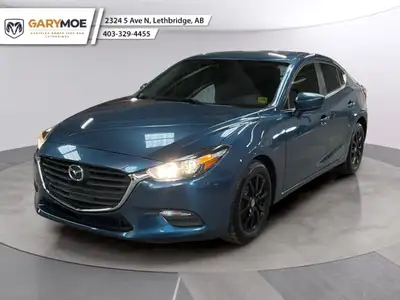 The 2018 Mazda Mazda3 GS Auto is a stylish blue sedan with front-wheel drive that offers exceptional...