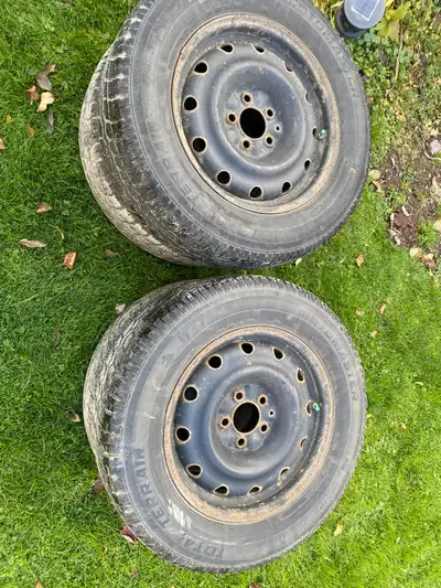 Four 16 inch 215 /70 r 16 winter tires on rims Tread is low but rims are in good shape $40