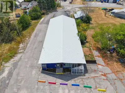 6,705 sf commercial-industrial property plus a 448 sf outbuilding, situated along Highway 2 - Greate...