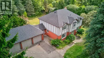 Beautiful Tudor Style Home on approx. 1 acre of land in the prestigious & Exclusive Sought After Enc...