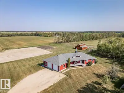 This Beautiful Home with an Oversized Double Attached Garage, Barn, and Double Detached Garage is si...
