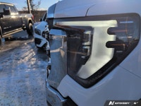 The new 2026 GMC Sierra 2500HD SLT in a bright white finish with 44 drivetrain is engineered for the... (image 8)