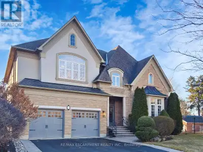 A truly one-of-a-kind home nestled on a premium pie-shaped lot in Oakville's sought-after Lakeshore...