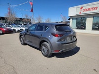 Command every journey with confidence and sophistication in this Machine Grey Metallic 2021 Mazda CX... (image 2)