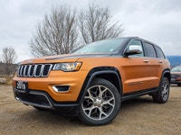 Introducing the stunning 2019 Jeep Grand Cherokee Limited 4x4, a vibrant orange SUV that promises an... (image 6)