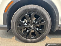 The 2026 Honda CR-V Hybrid Touring isn't just an SUV; it's your efficient and sophisticated partner... (image 8)