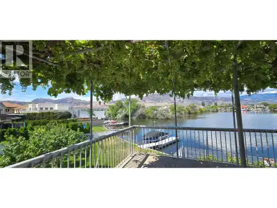 This well-maintained waterfront residence is situated on the bay of Osoyoos Lake, offering an except...