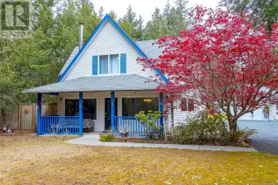 Tucked away on 1.12 private acres north of Qualicum Beach, 1335 Meadowood Way is a charming country...