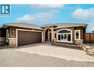 Welcome to this warm and inviting rancher with a self-contained walk-out basement, perfect for multi...