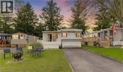 AFFORDABLE LIVING! Lovely 2 bedroom mobile home in picturesque Green Acres Park at edge of Waterloo....