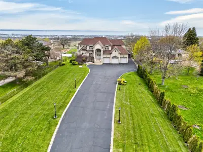 Perched atop the Niagara Escarpment on a spectacular 0.81-acre gated estate, 803 Ridge Road offers a...