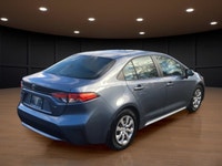 The 2021 Toyota Corolla LE in sleek gray with its reliable front-wheel drive and automatic transmiss... (image 5)
